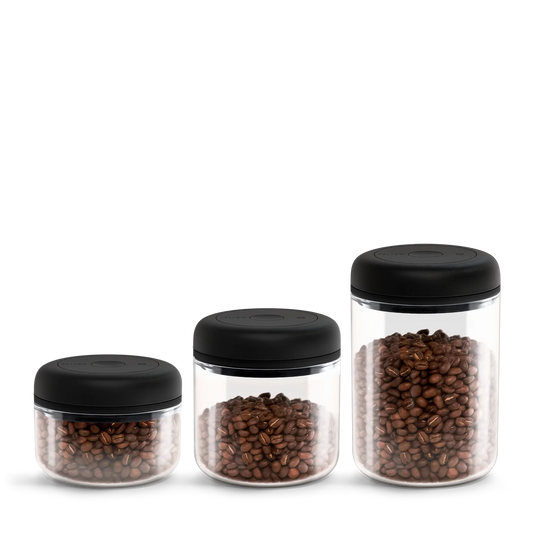 Fellow Atmos Vacuum Canister 3 Pack: clear jars with black lids in multiple sizes.
