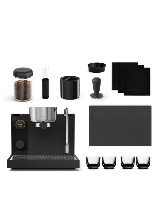 Fellow Series 1 + Accessories Kit: espresso machine, beans, cups, tamper, and mat.