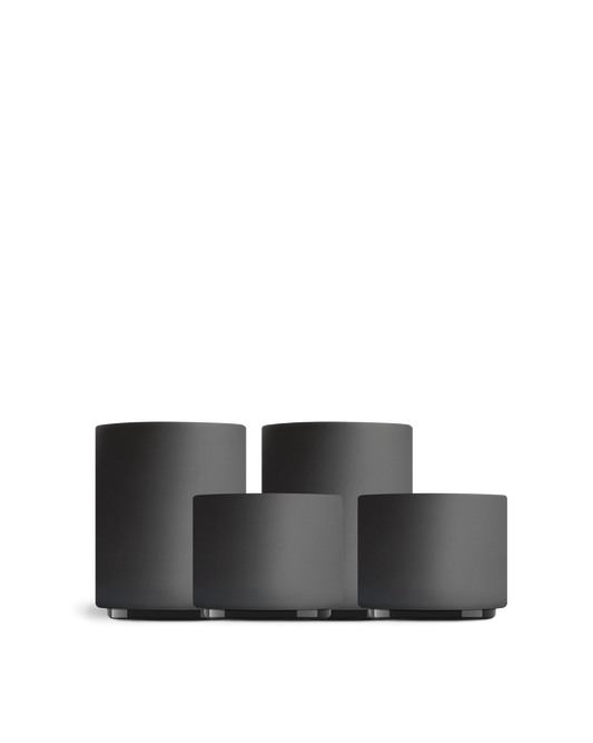 Four matte black Fellow Latte Art Set cups in different sizes on a white background.